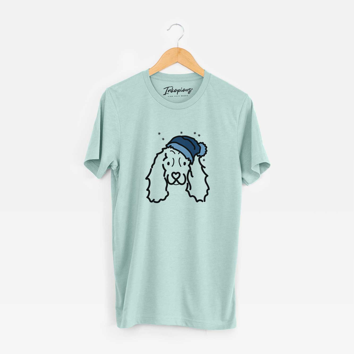 Minimalist line drawing of an American Cocker Spaniel wearing a winter beanie on a Heather Sage Unisex crewneck