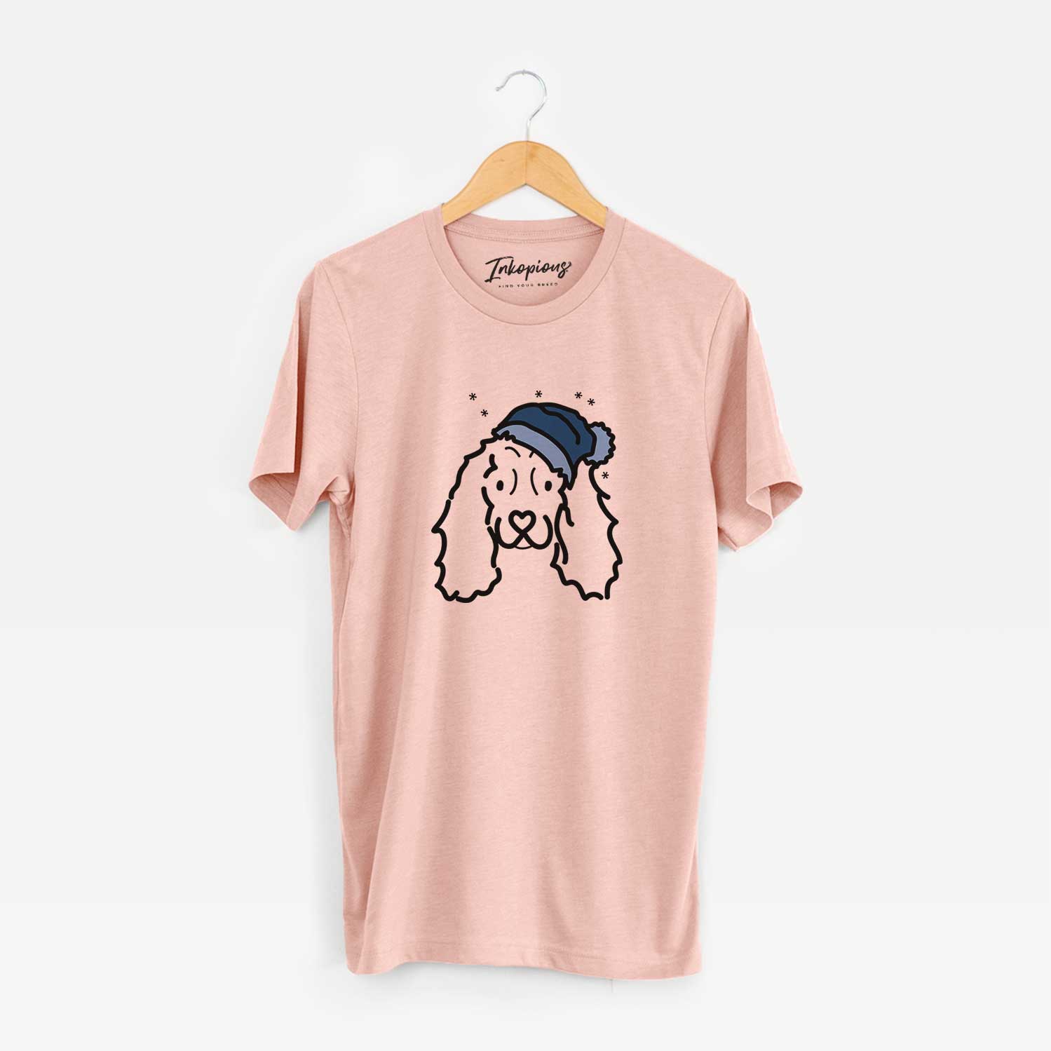 Minimalist line drawing of an American Cocker Spaniel wearing a winter beanie on a Peach Unisex crewneck