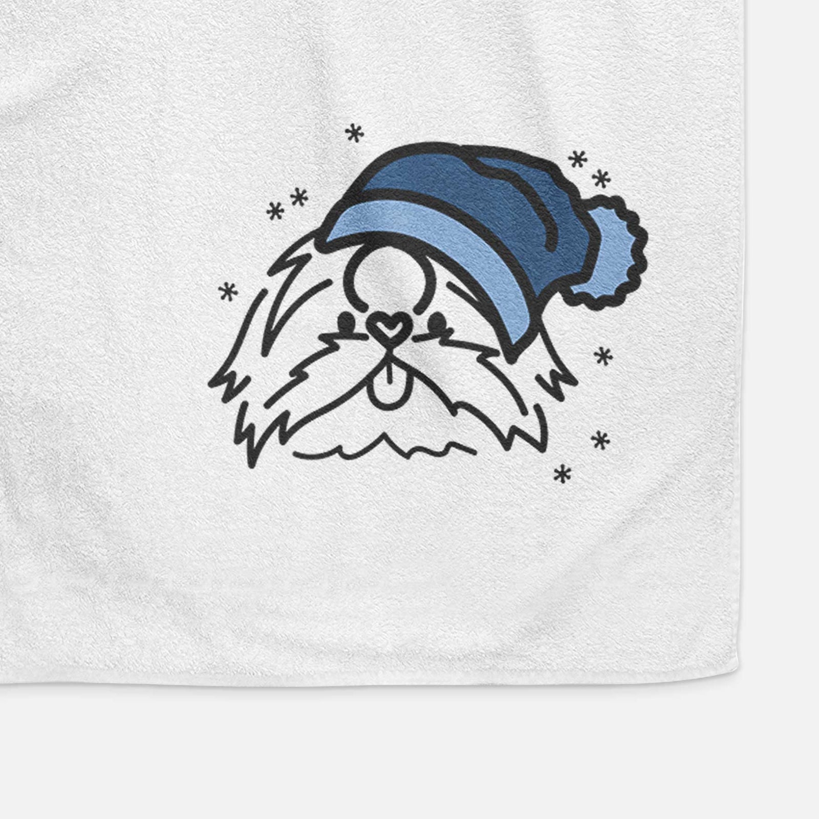 Minimalist line drawing of CoCo the Shih Tzu wearing a winter beanie on a decorative hand towel