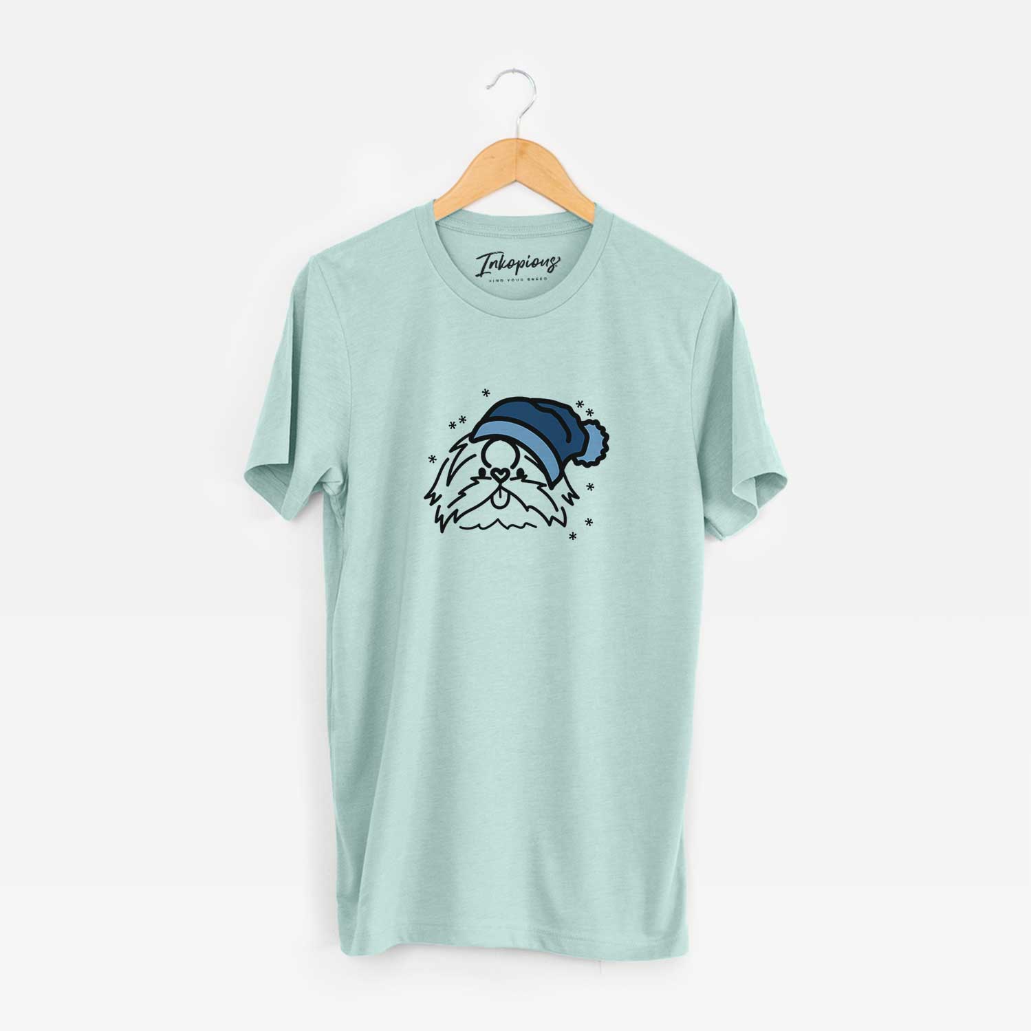 Minimalist line drawing of CoCo the Shih Tzu wearing a winter beanie on a Heather Sage Unisex crewneck