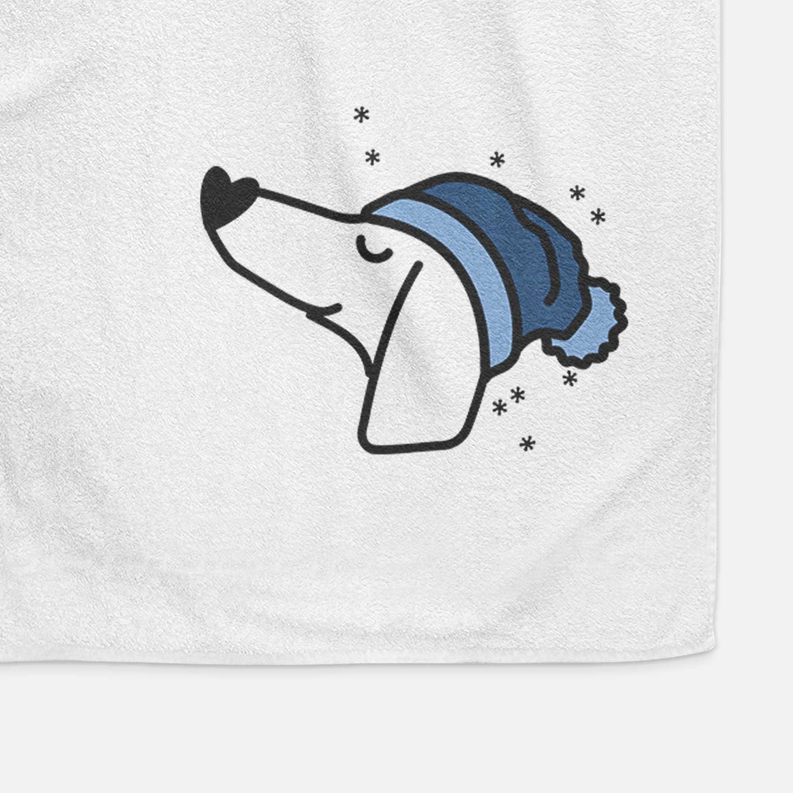 Minimalist line drawing of a Dachshund wearing a winter beanie on a decorative hand towel