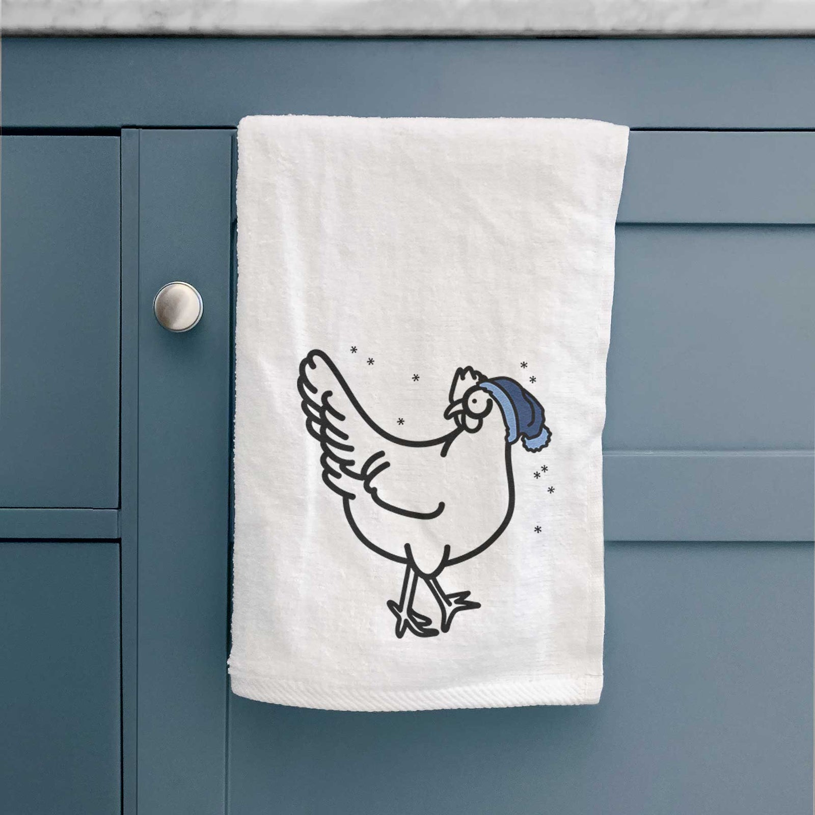 Minimalist line drawing of Daisy the Chicken wearing a winter beanie on a decorative hand towel