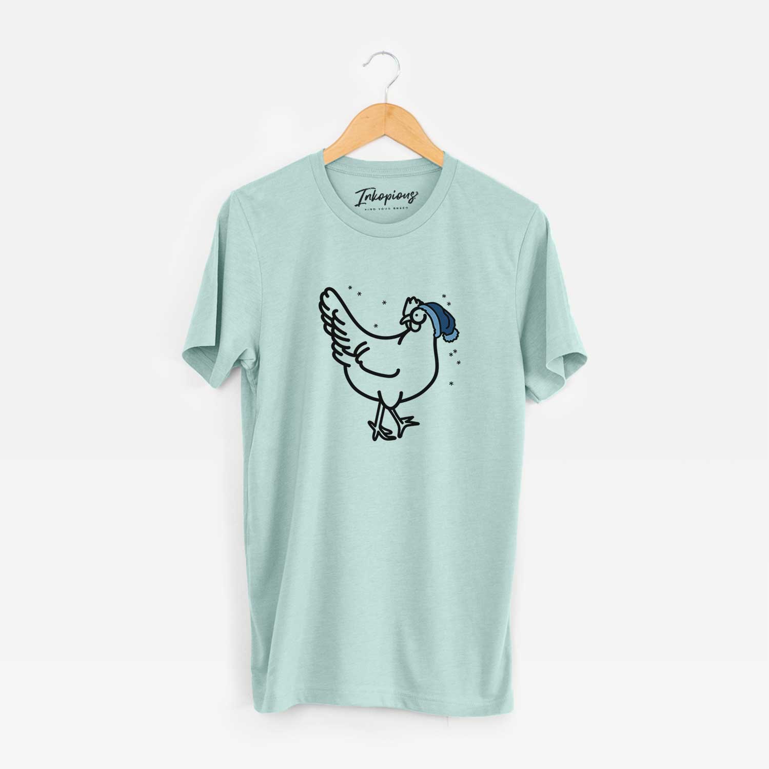 Minimalist line drawing of Daisy the Chicken wearing a winter beanie on a Heather Sage Unisex crewneck