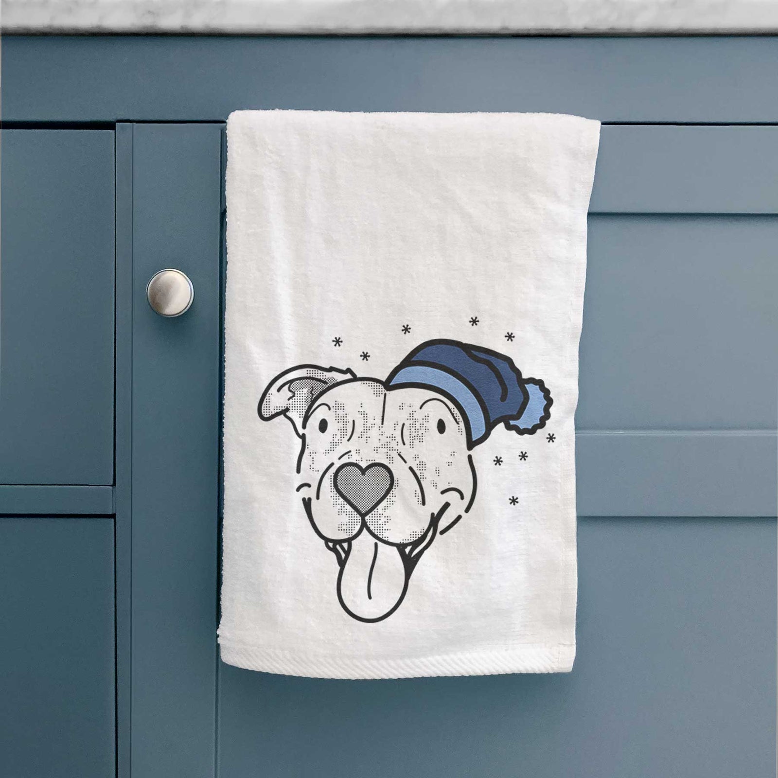 Minimalist line drawing of Dottie the Pitbull Mix wearing a winter beanie on a decorative hand towel