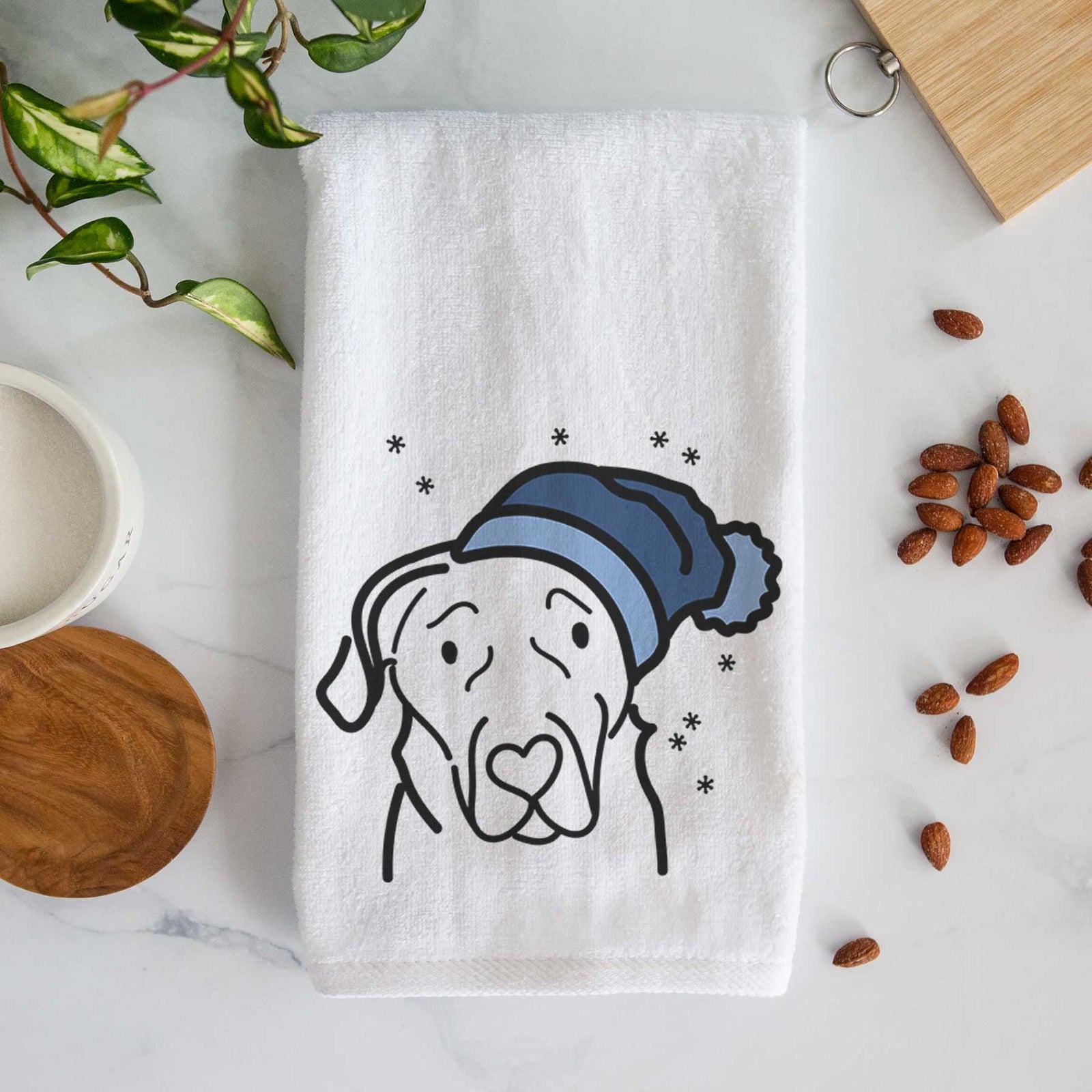 Minimalist line drawing of an English Labrador wearing a winter beanie on a decorative hand towel