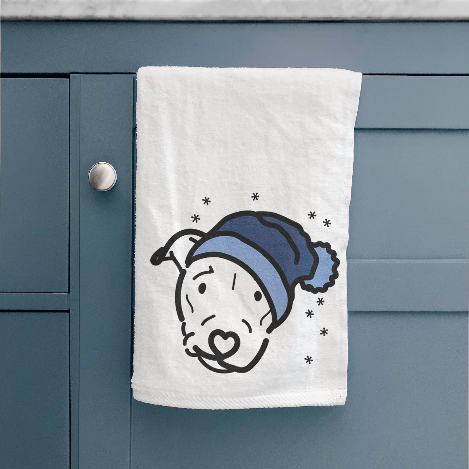Minimalist line drawing of Ernie the Pitbull Mix wearing a winter beanie on a decorative hand towel