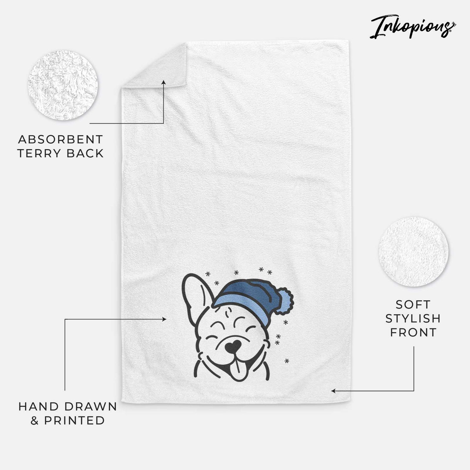 Minimalist line drawing of a French Bulldog wearing a winter beanie on a decorative hand towel