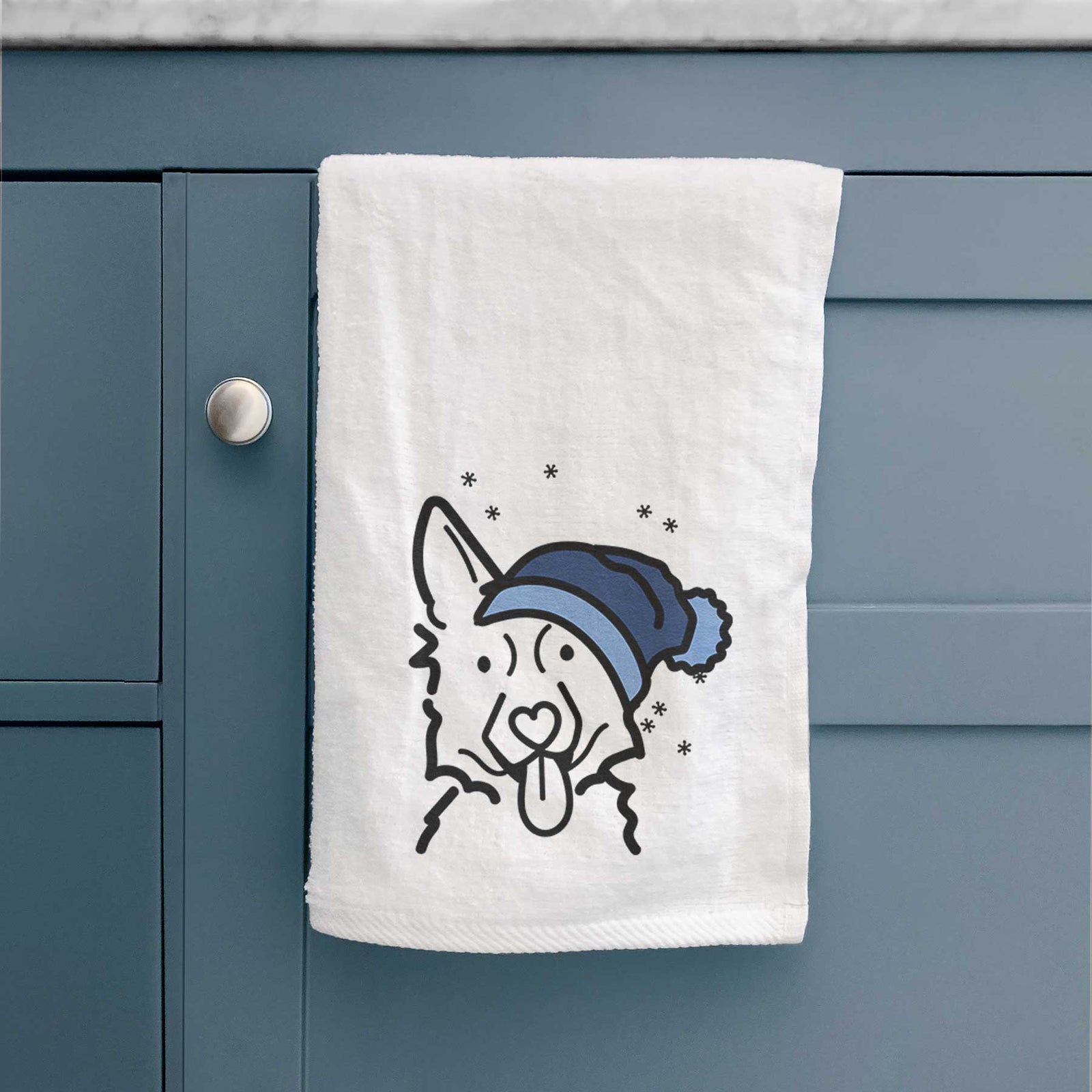 Minimalist line drawing of a German Shepherd wearing a winter beanie on a decorative hand towel