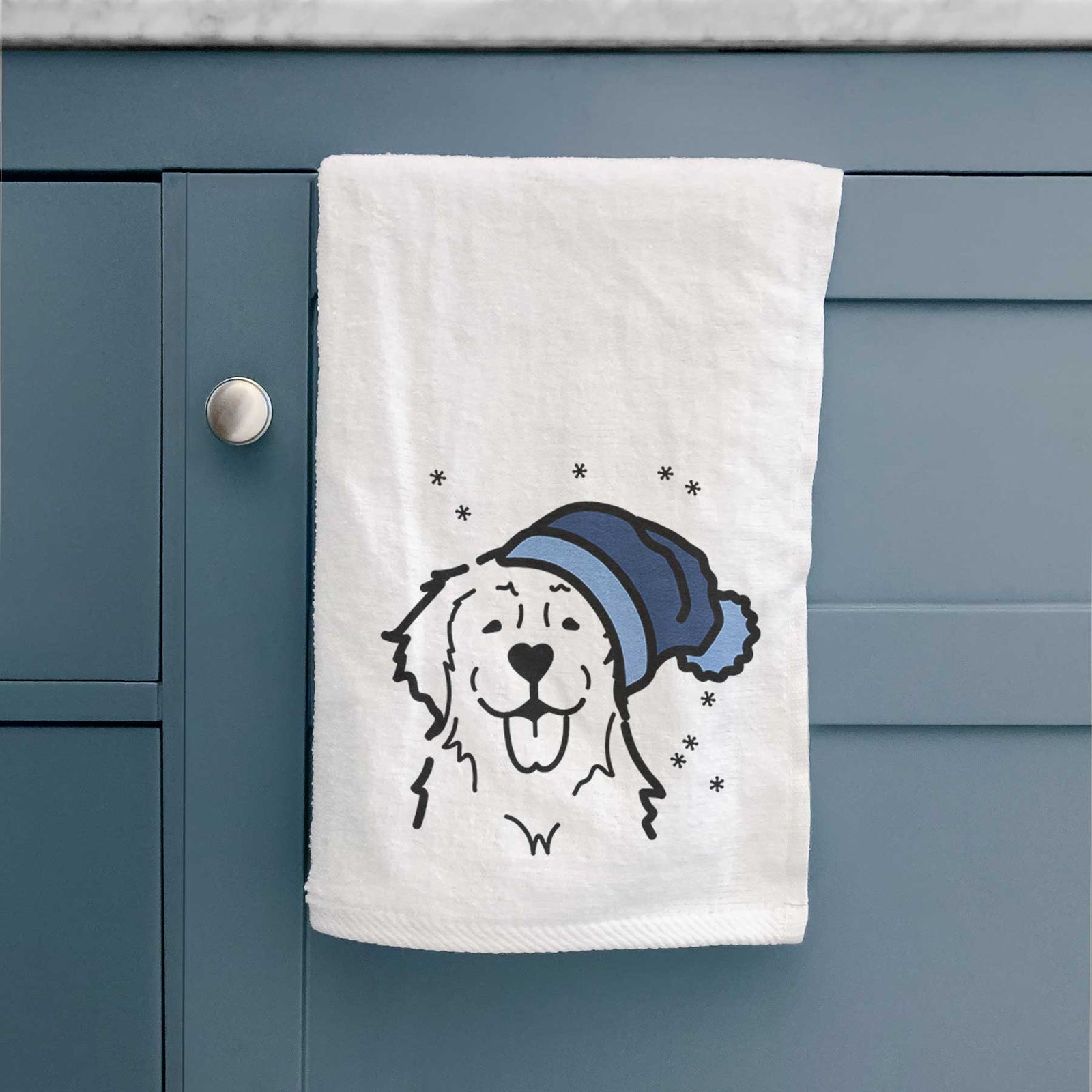 Minimalist line drawing of a Golden Retriever wearing a winter beanie on a decorative hand towel