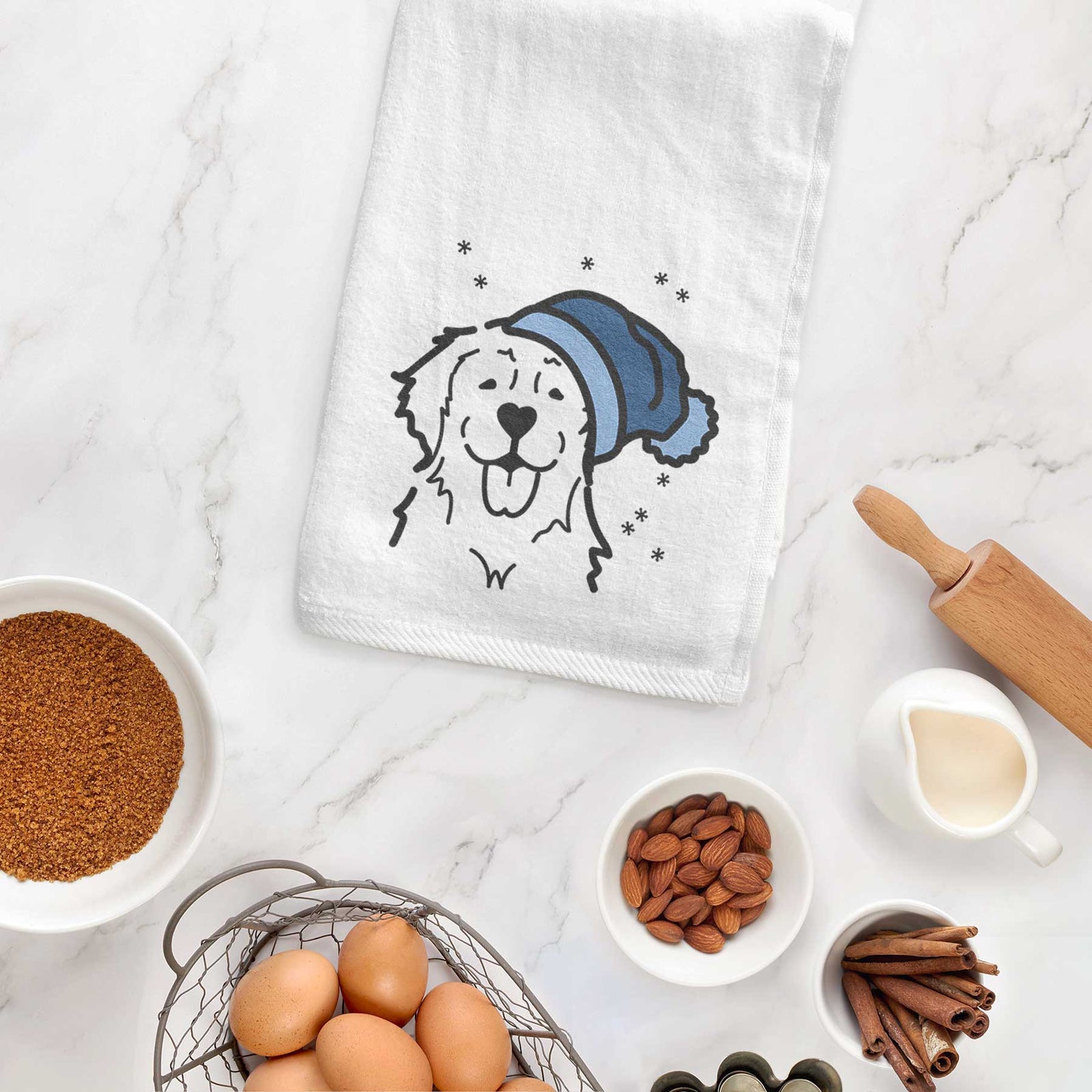 Minimalist line drawing of a Golden Retriever wearing a winter beanie on a decorative hand towel
