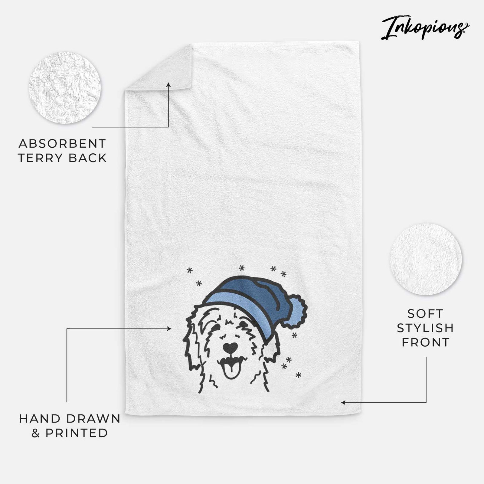 Minimalist line drawing of a Goldendoodle wearing a winter beanie on a decorative hand towel