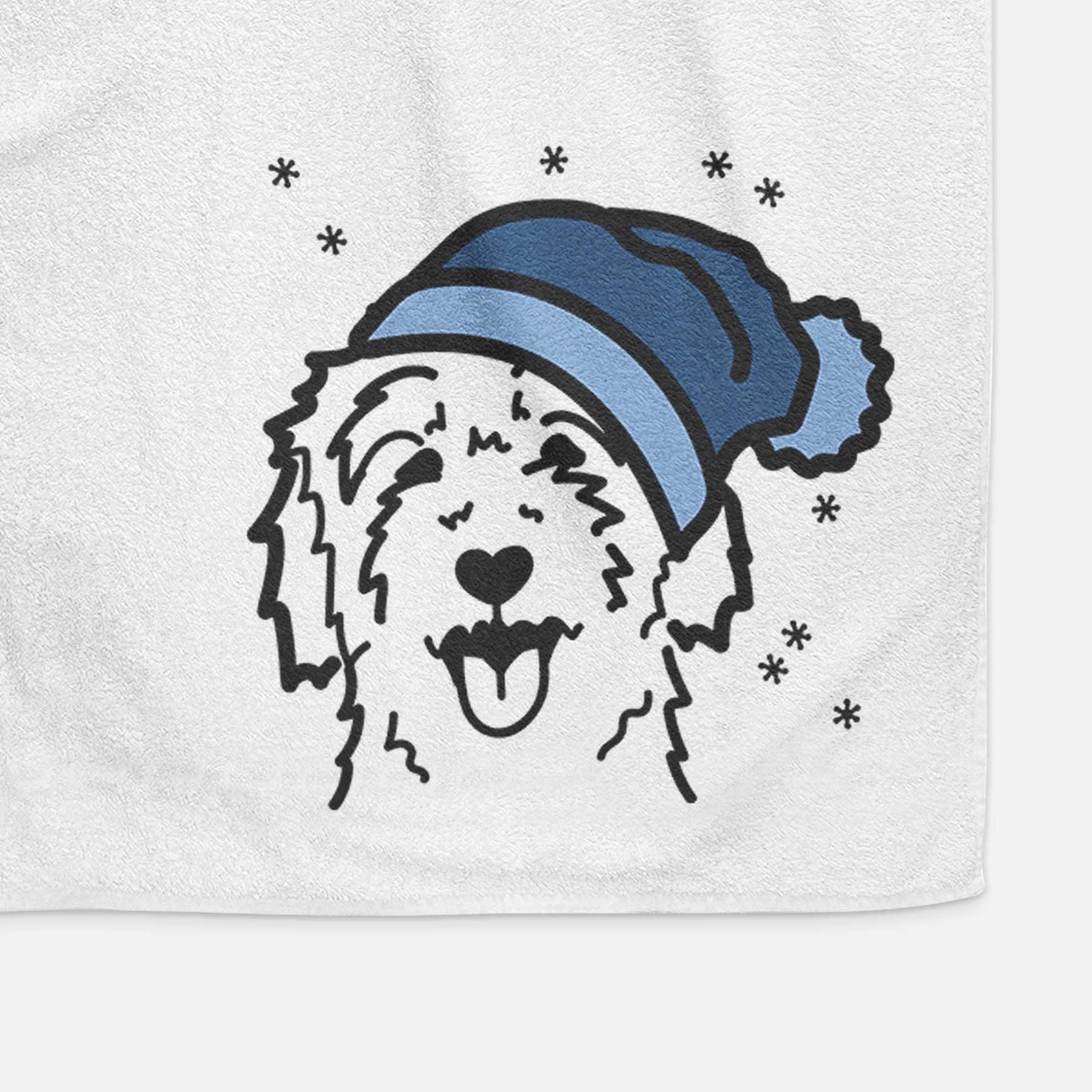 Minimalist line drawing of a Goldendoodle wearing a winter beanie on a decorative hand towel
