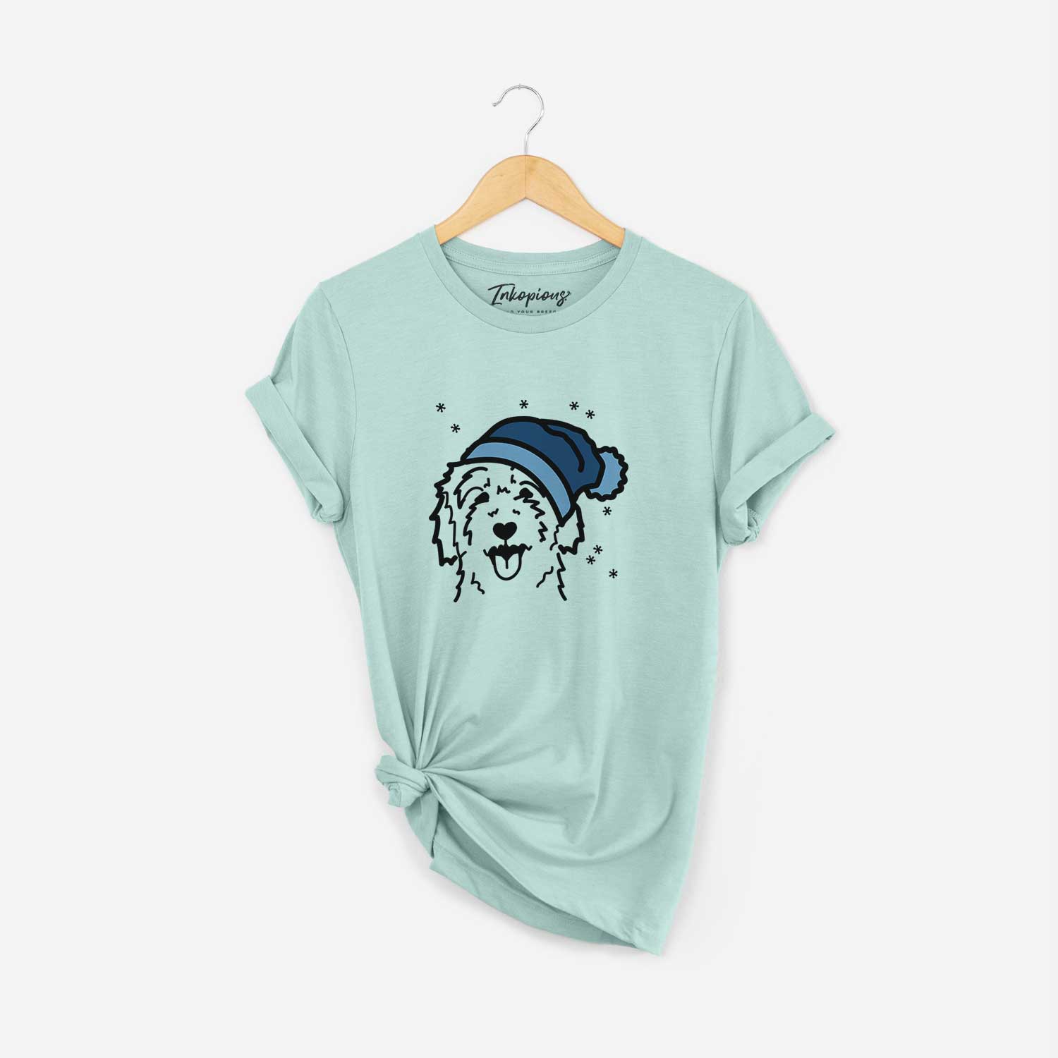 Minimalist line drawing of a Goldendoodle wearing a winter beanie on a Heather Sage Unisex crewneck