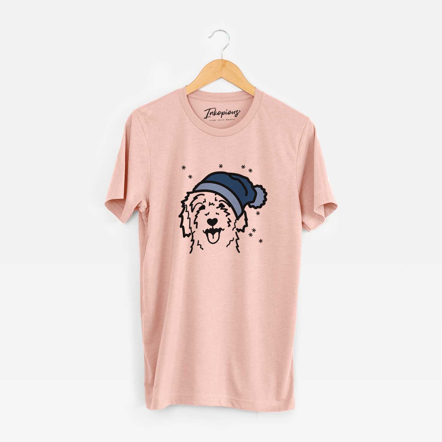 Minimalist line drawing of a Goldendoodle wearing a winter beanie on a Peach Unisex crewneck