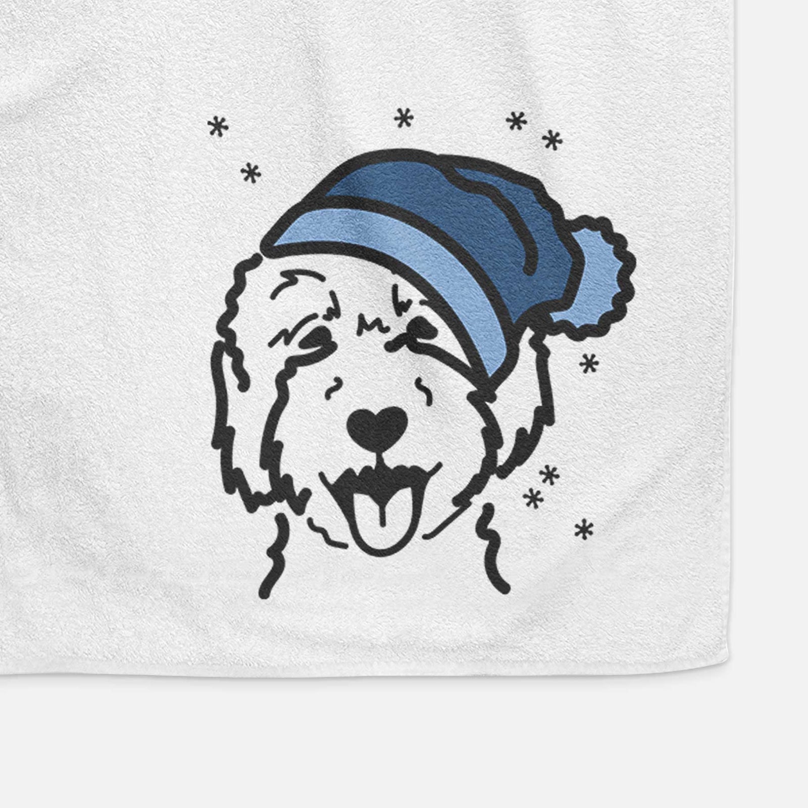 Minimalist line drawing of a Goldendoodle 2 wearing a winter beanie on a decorative hand towel