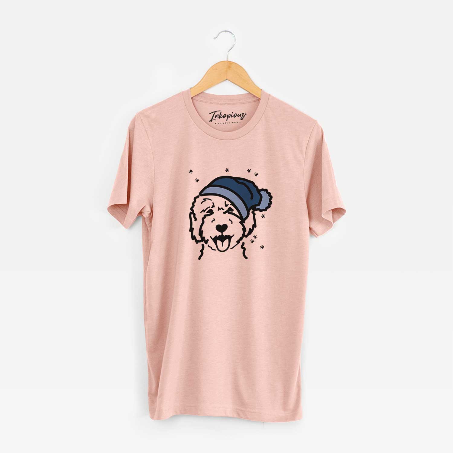 Minimalist line drawing of a Goldendoodle 2 wearing a winter beanie on a Peach Unisex crewneck