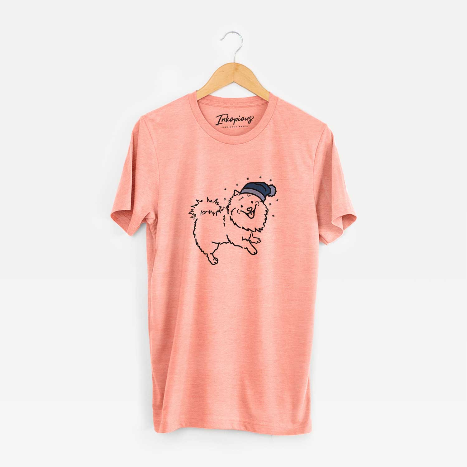 Minimalist line drawing of Goldie the Pomeranian Mix wearing a winter beanie on a Sunset Unisex crewneck