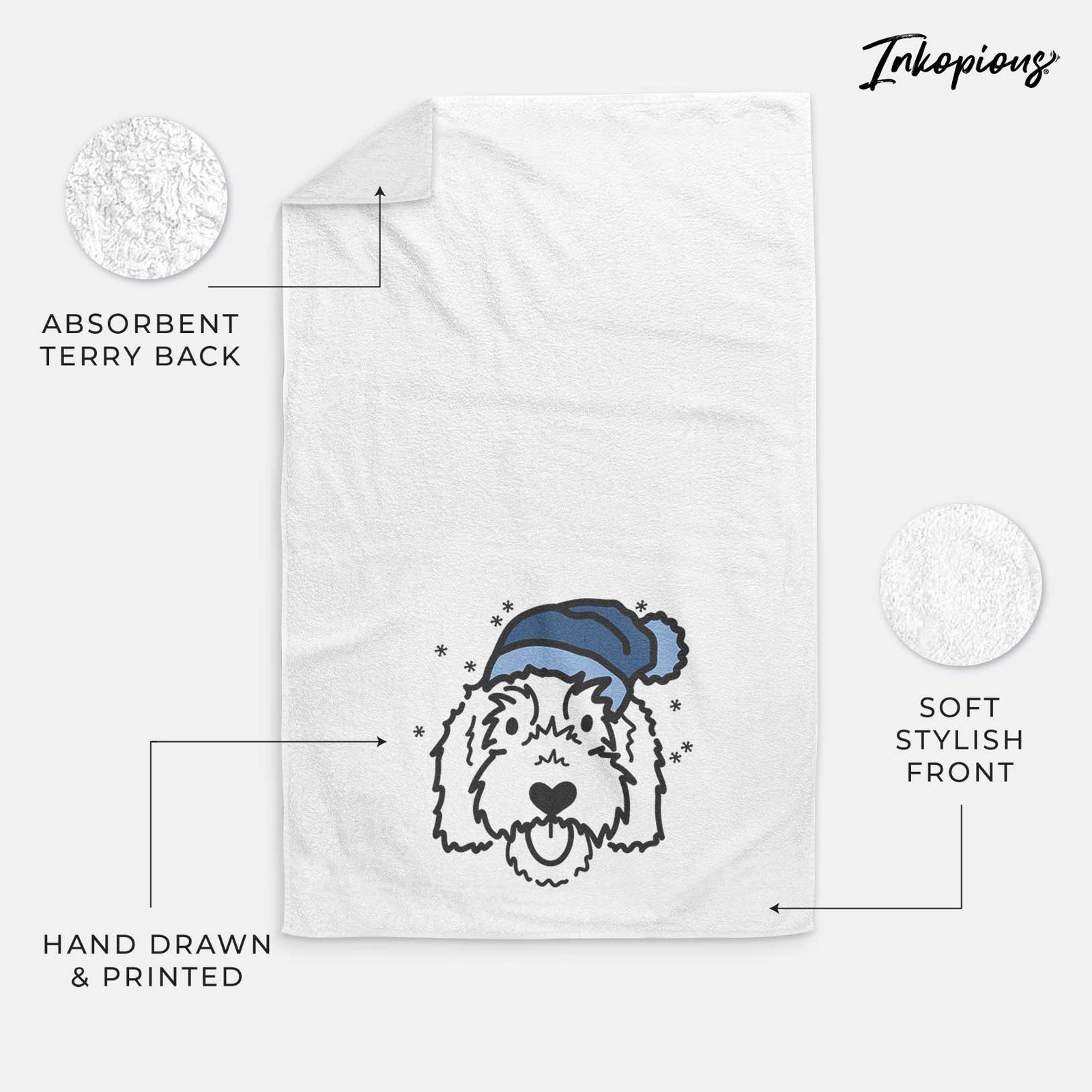 Minimalist line drawing of Gus the Goldendoodle wearing a winter beanie on a decorative hand towel