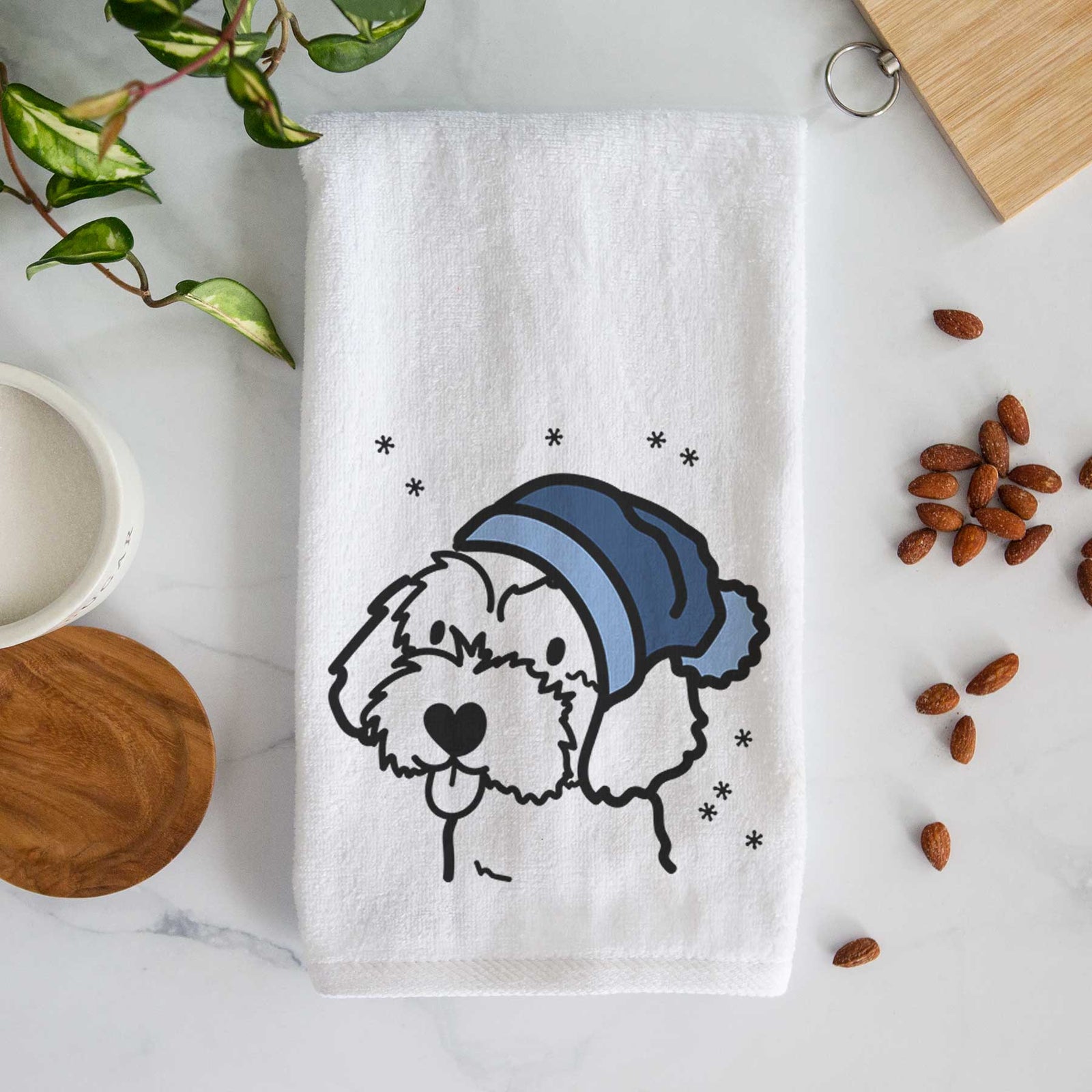 Minimalist line drawing of a Havapoo wearing a winter beanie on a decorative hand towel