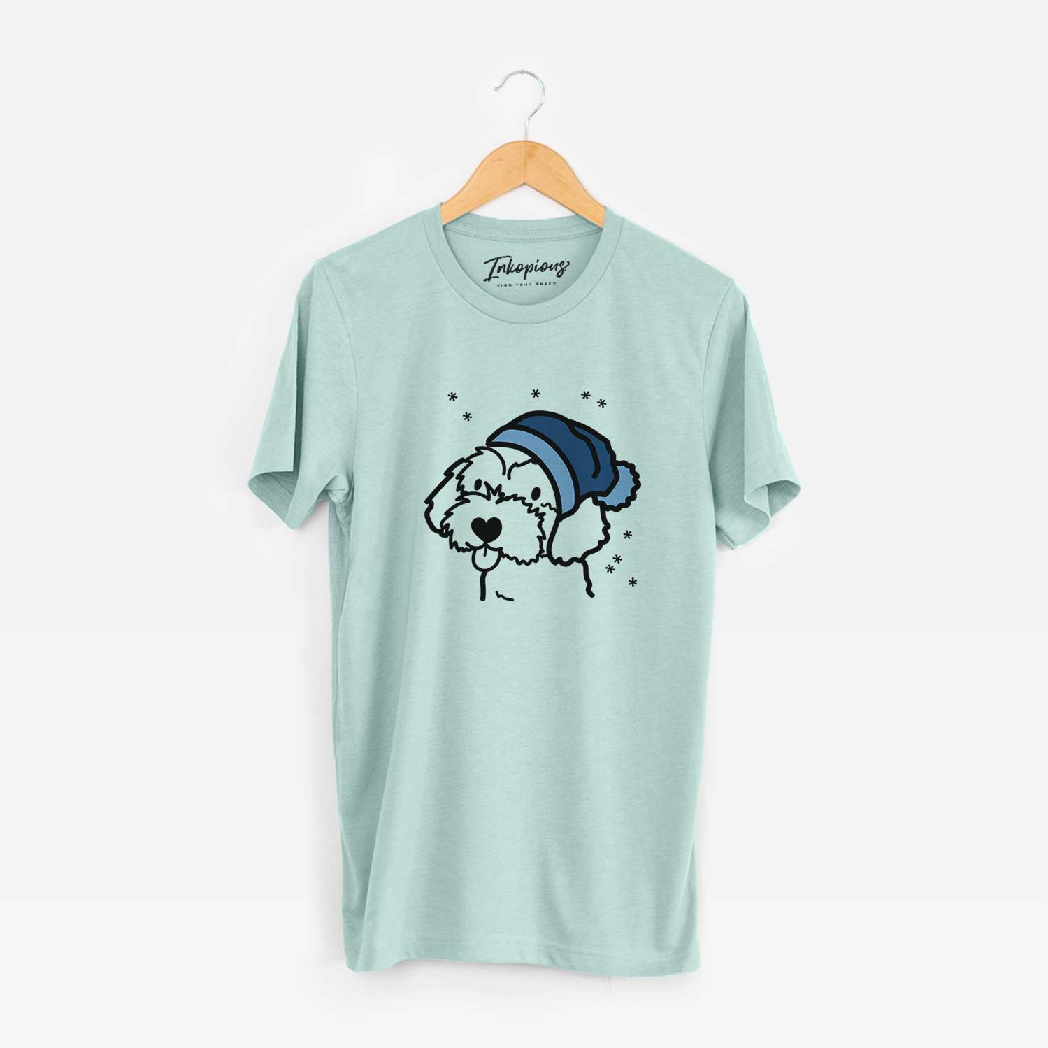 Minimalist line drawing of a Havapoo wearing a winter beanie on a Heather Sage Unisex crewneck