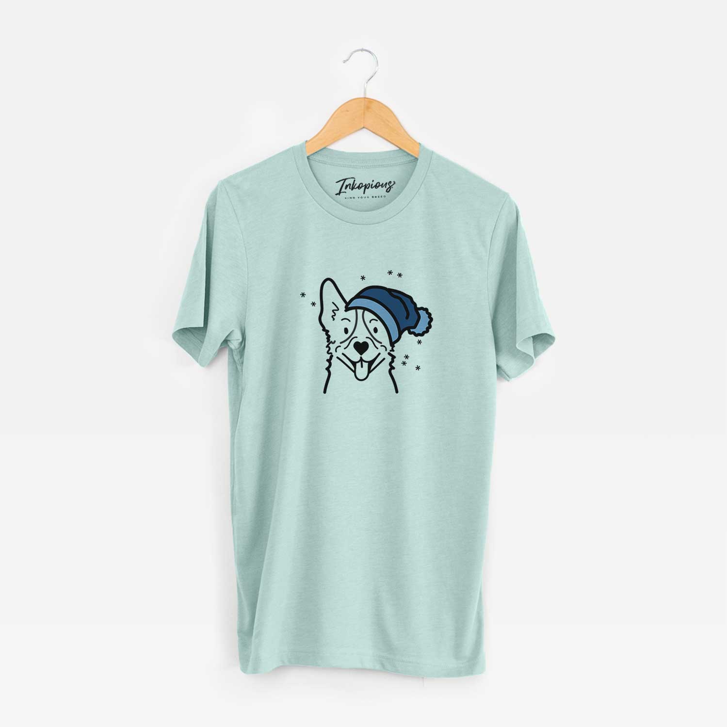 Minimalist line drawing of a Heeler wearing a winter beanie on a Heather Sage Unisex crewneck