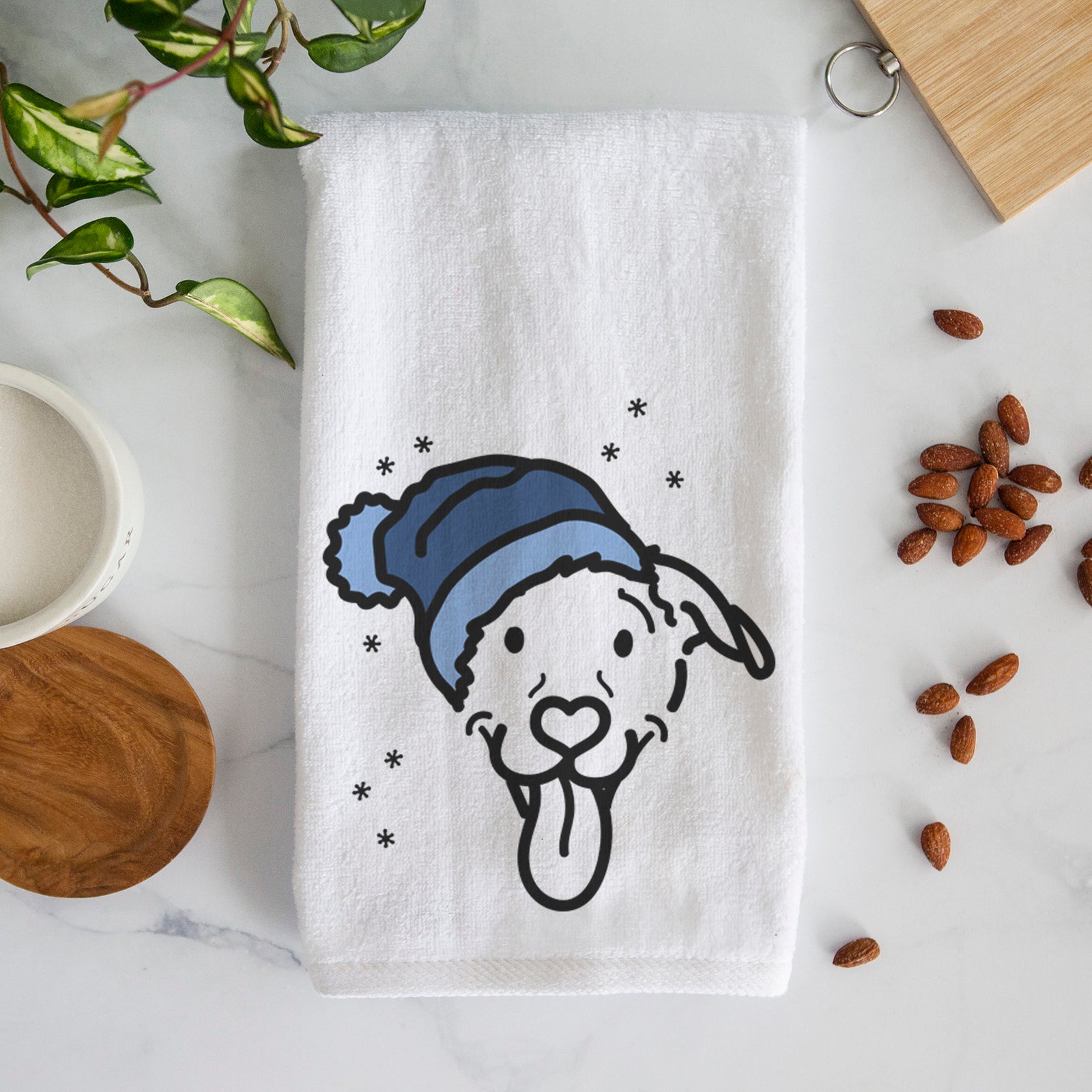Minimalist line drawing of Hemi the Pitbull Mix wearing a winter beanie on a decorative hand towel