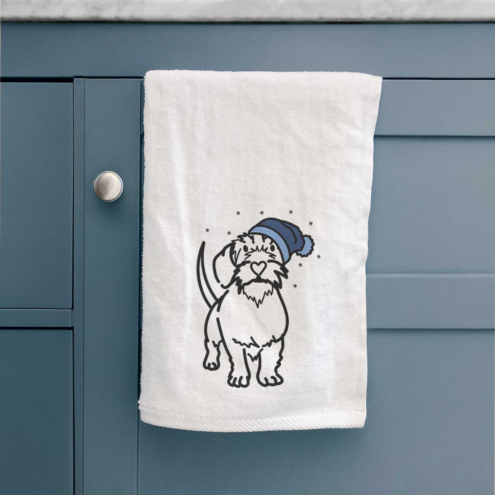 Minimalist line drawing of Henry the Wire Dachshund wearing a winter beanie on a decorative hand towel
