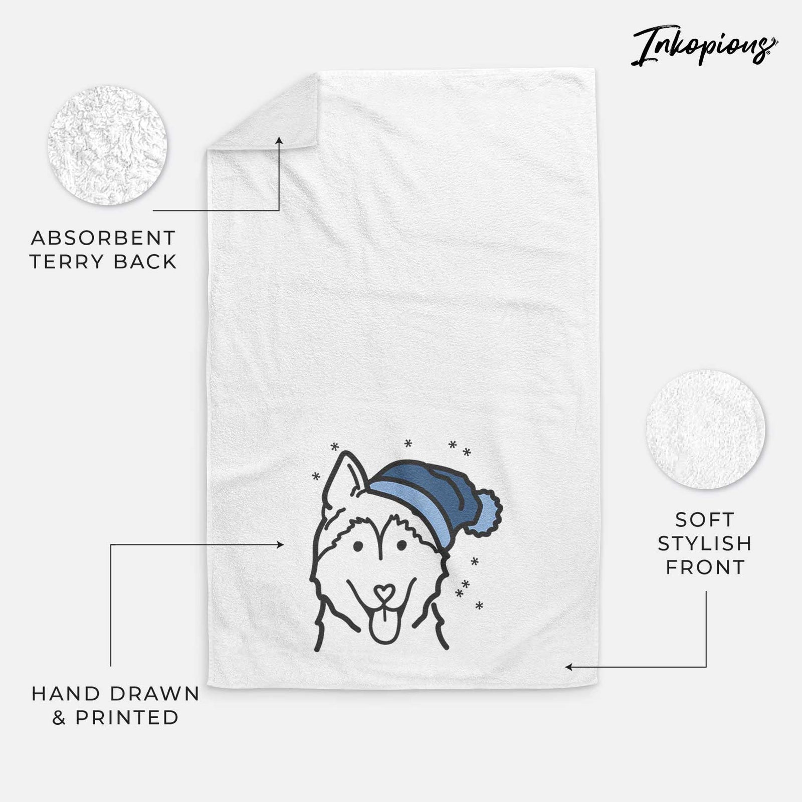 Minimalist line drawing of a Siberian Husky wearing a winter beanie on a decorative hand towel