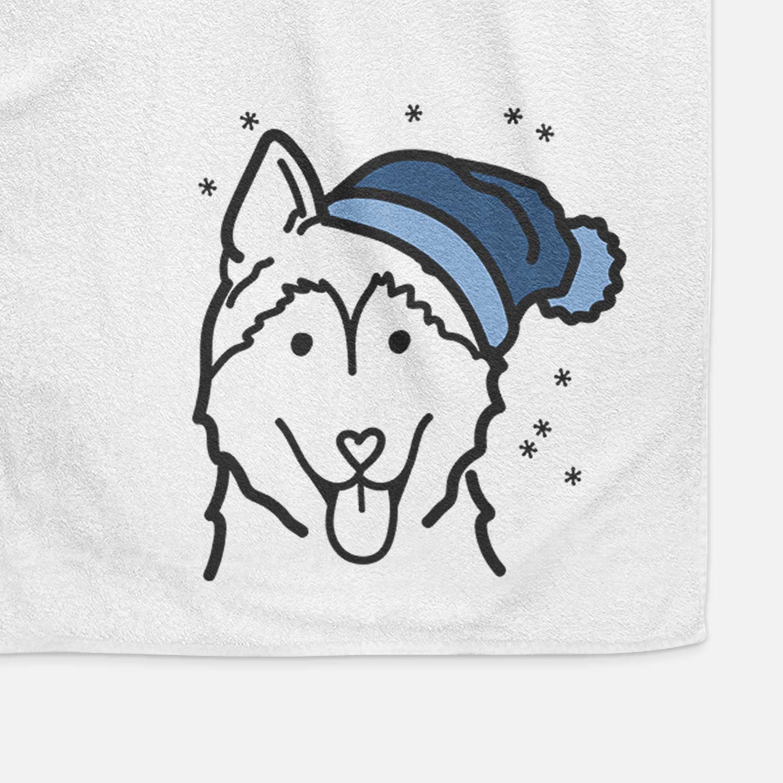 Minimalist line drawing of a Siberian Husky wearing a winter beanie on a decorative hand towel