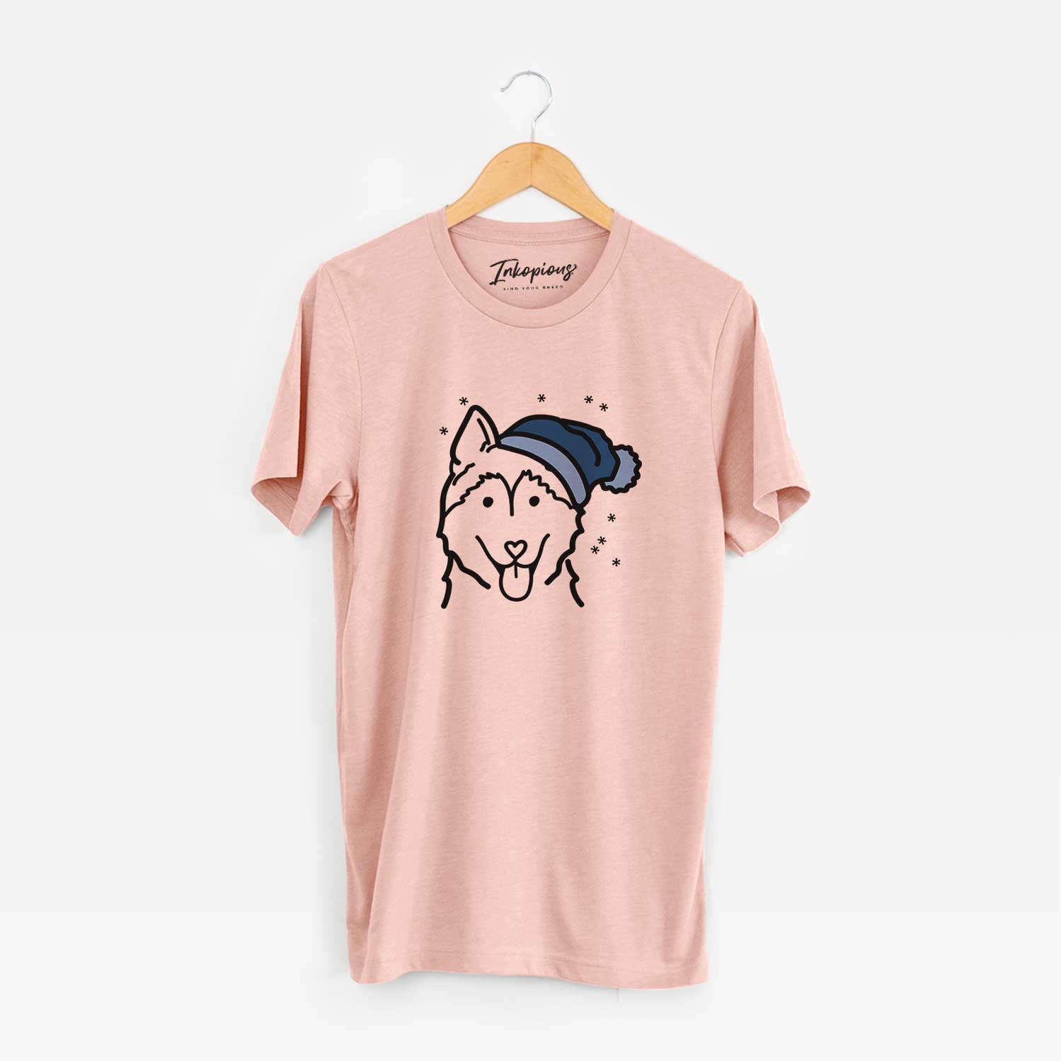 Minimalist line drawing of a Siberian Husky wearing a winter beanie on a Peach Unisex crewneck