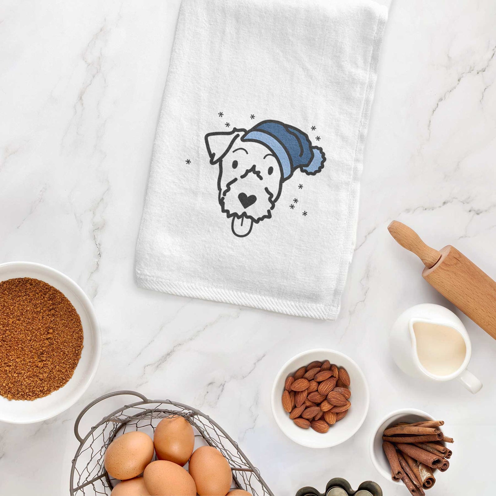 Minimalist line drawing of a Jack Russell Terrier wearing a winter beanie on a decorative hand towel