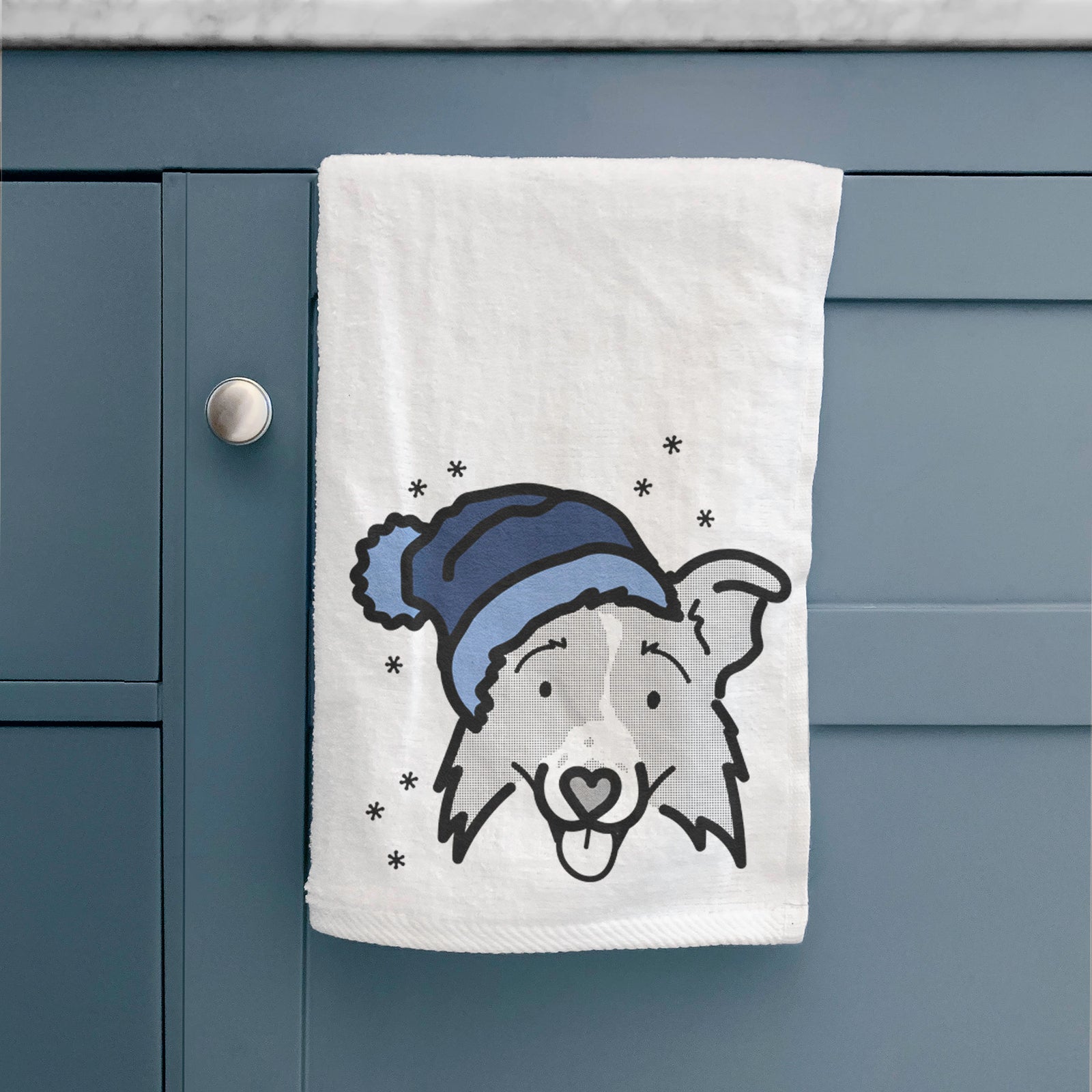 Minimalist line drawing of Jam the Border Collie 2.0 wearing a winter beanie on a decorative hand towel