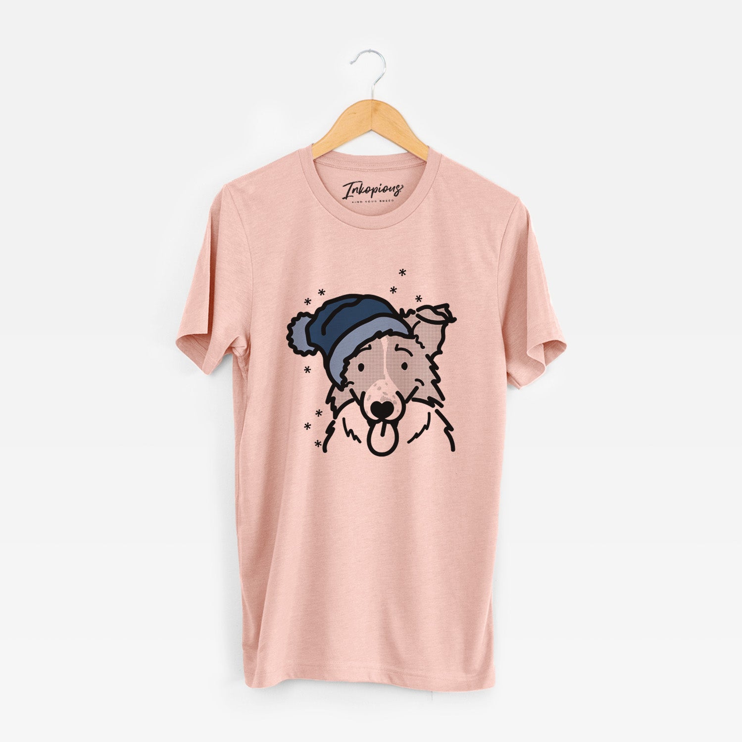 Minimalist line drawing of Jam the Border Collie wearing a winter beanie on a Peach Unisex crewneck