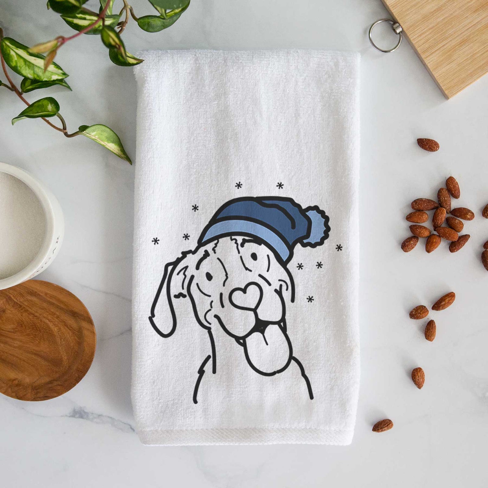 Minimalist line drawing of Kimble the Treeing Walker Coonhound wearing a winter beanie on a decorative hand towel
