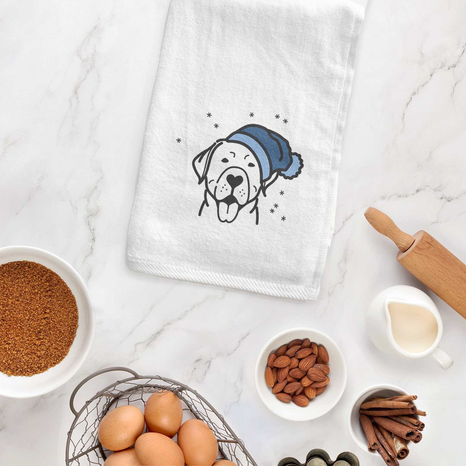 Minimalist line drawing of a Labrador Retriever wearing a winter beanie on a decorative hand towel