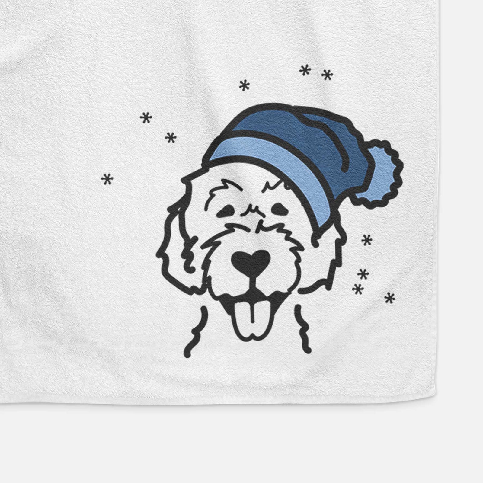 Minimalist line drawing of a Labradoodle wearing a winter beanie on a decorative hand towel