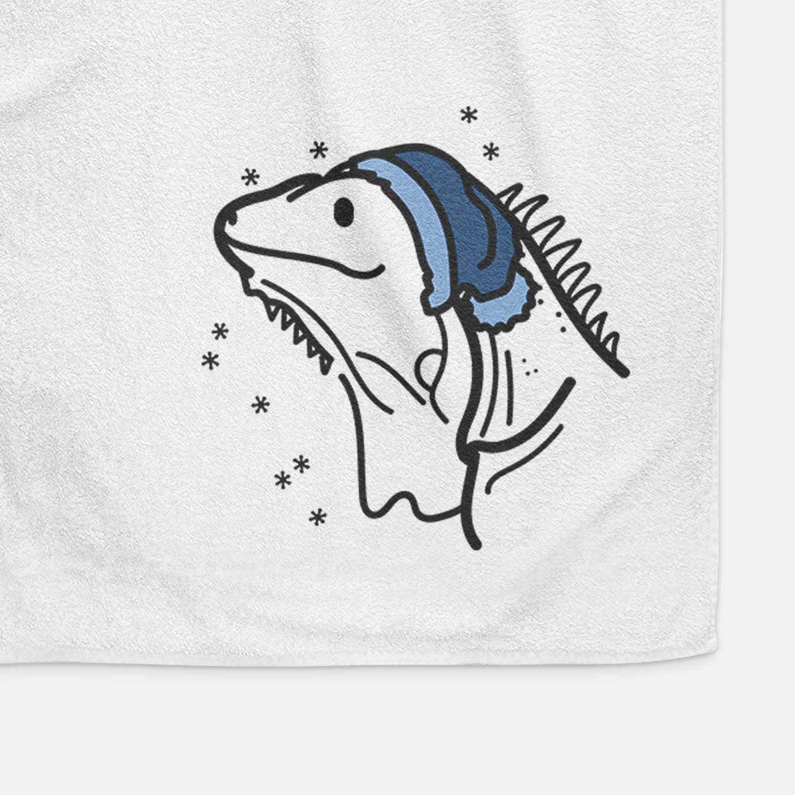 Minimalist line drawing of Louie the Iguana wearing a winter beanie on a decorative hand towel