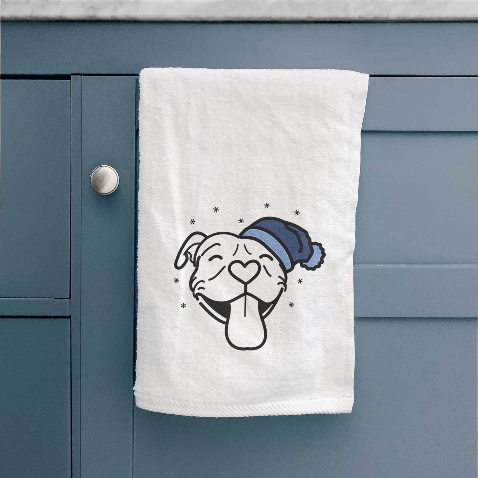 Minimalist line drawing of Louie the Pitbull wearing a winter beanie on a decorative hand towel