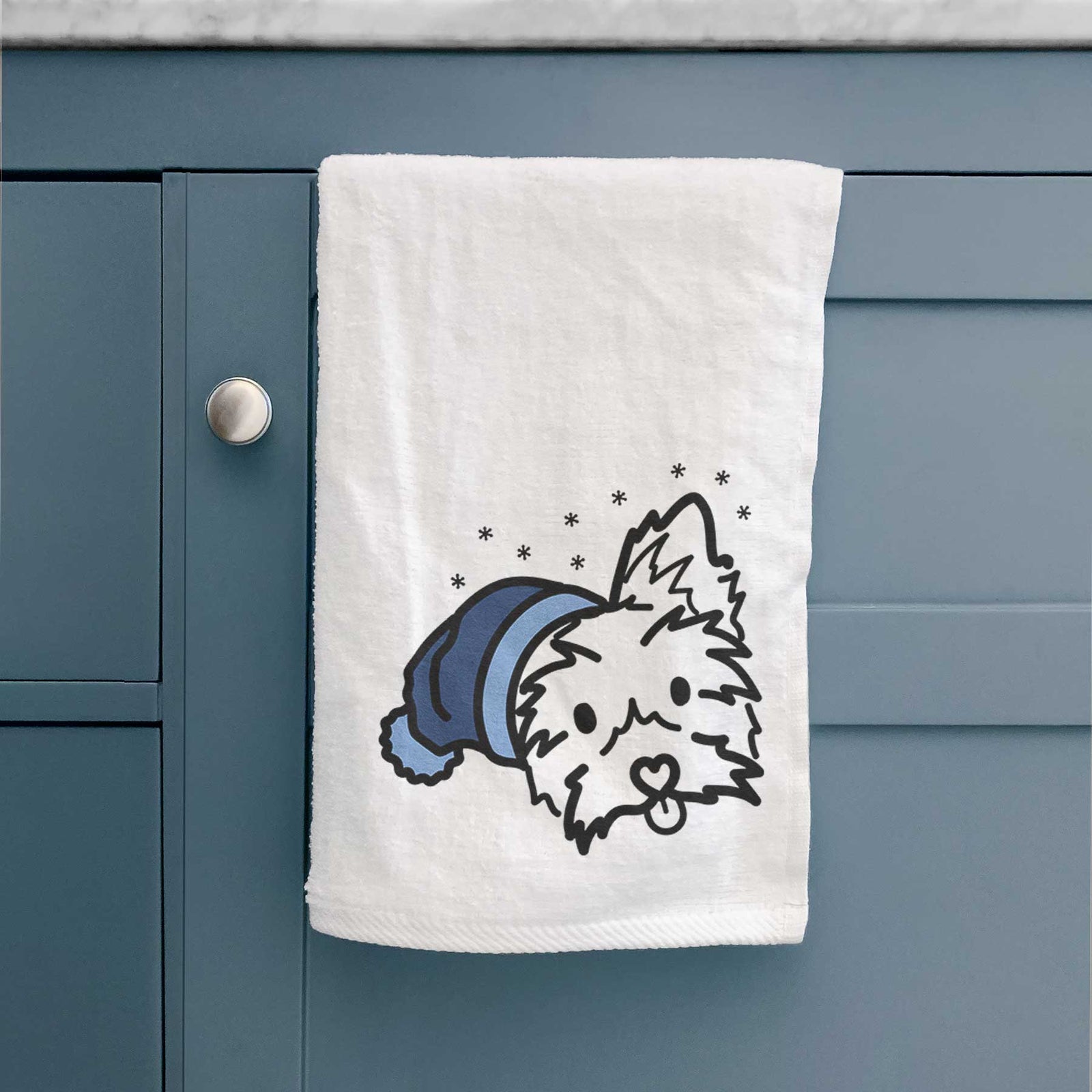 Minimalist line drawing of Luna the Yorkshire Terrier wearing a winter beanie on a decorative hand towel