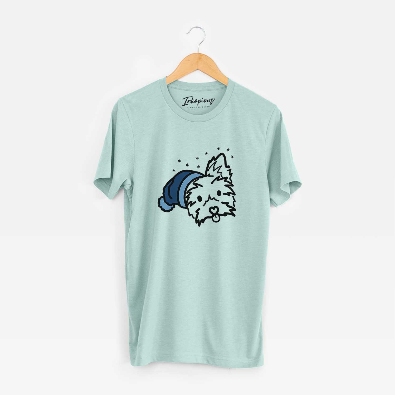 Minimalist line drawing of Luna the Yorkshire Terrier wearing a winter beanie on a Heather Sage Unisex crewneck