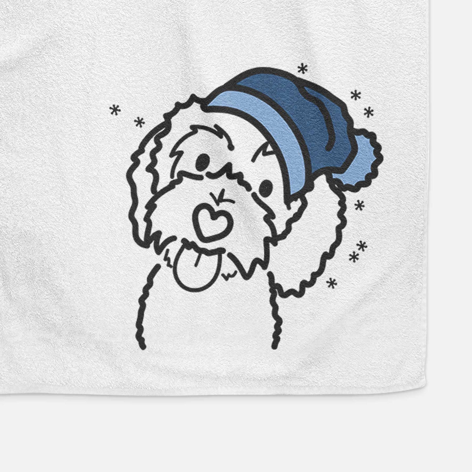 Minimalist line drawing of Mabel the Bernedoodle wearing a winter beanie on a decorative hand towel