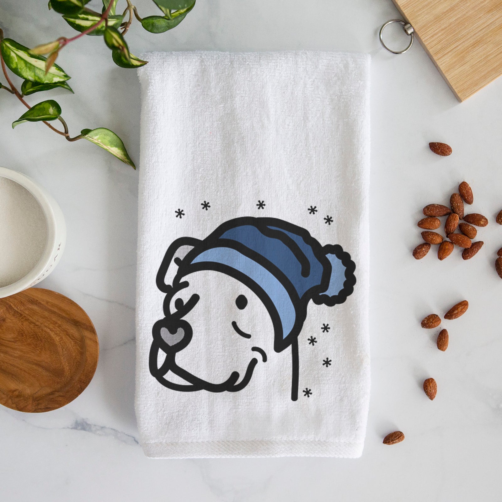 Minimalist line drawing of Mr. Sir the Pitbull Mix wearing a winter beanie on a decorative hand towel