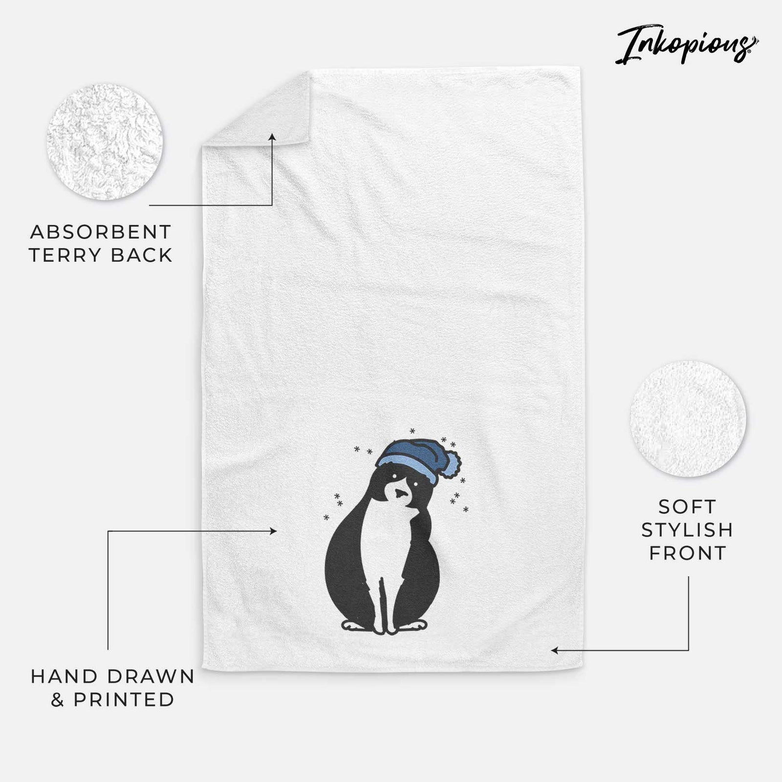 Minimalist line drawing of Oliver the Tuxedo Cat wearing a winter beanie on a decorative hand towel