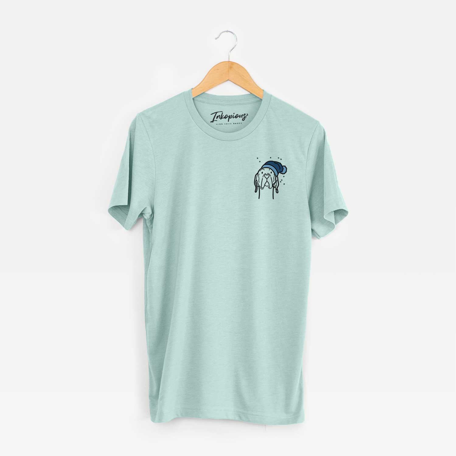 Small chest-pocket minimalist line drawing of an English Pointer wearing a winter beanie on a Heather Sage Unisex crewneck