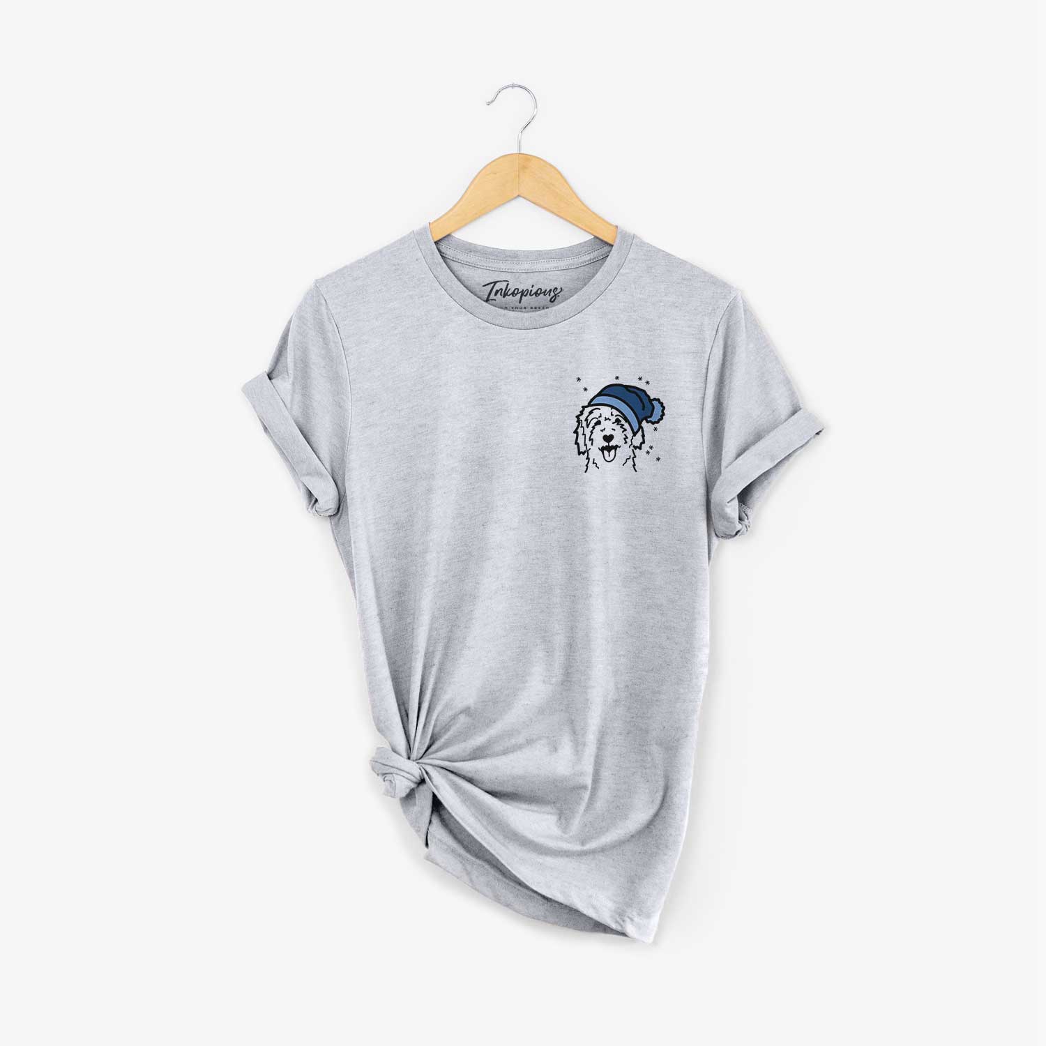 Small chest-pocket minimalist line drawing of a Goldendoodle wearing a winter beanie on a Grey Unisex crewneck