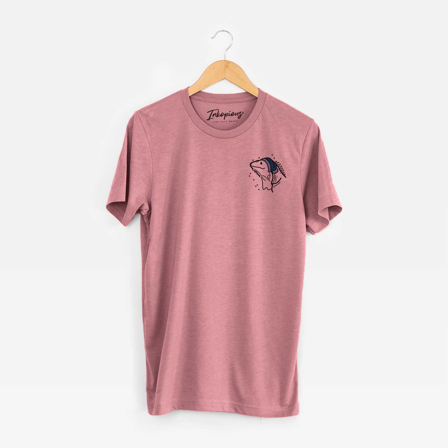 Small chest-pocket minimalist line drawing of Louie the Iguana wearing a winter beanie on a Mauve Unisex crewneck