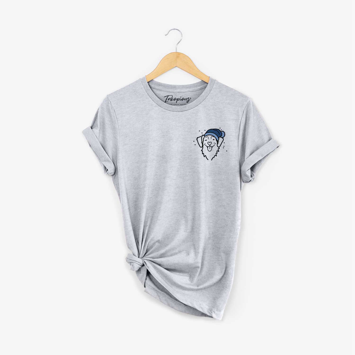 Small chest-pocket minimalist line drawing of a Nova Scotia Duck Tolling Retriever wearing a winter beanie on a Grey Unisex crewneck