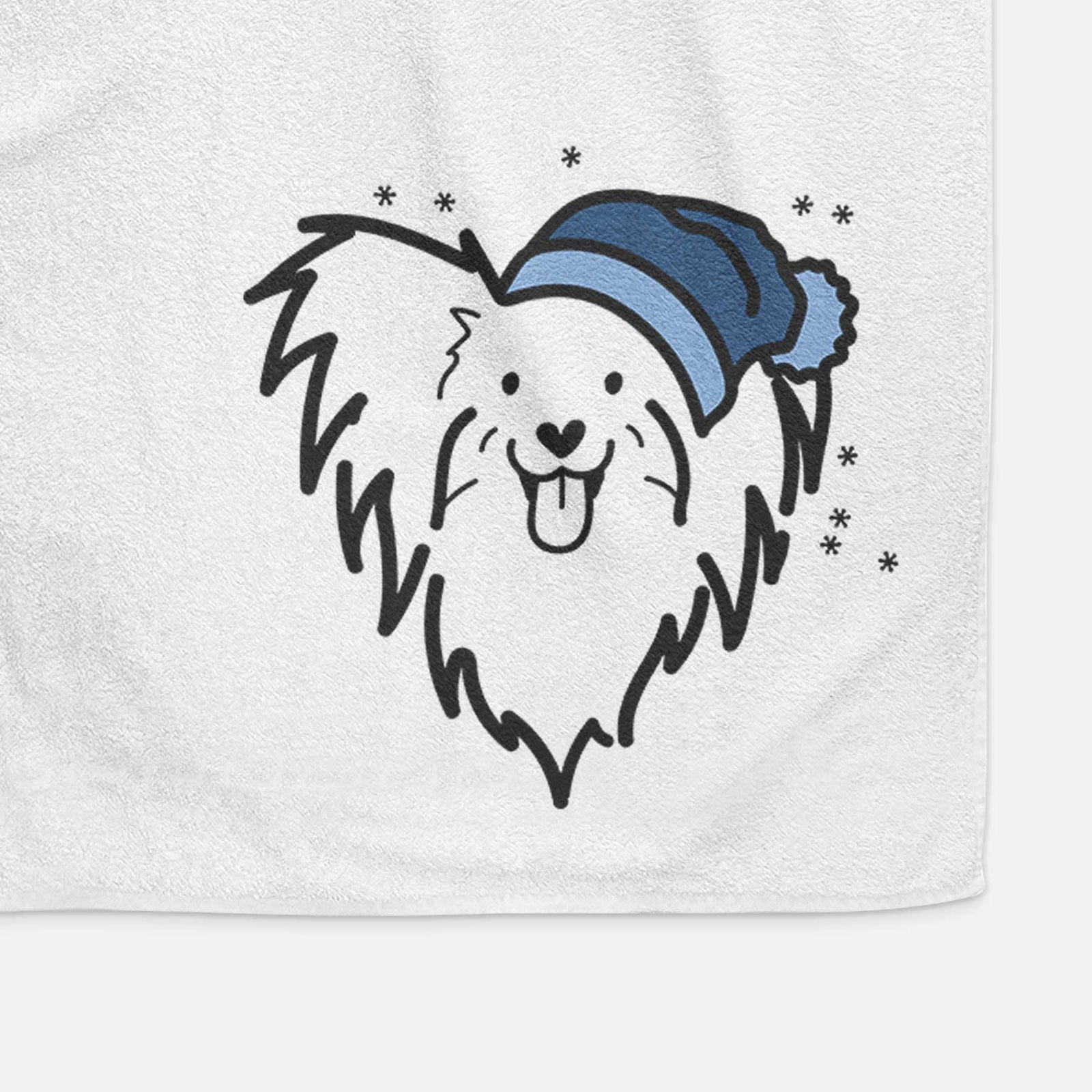 Minimalist line drawing of a Papillon wearing a winter beanie on a decorative hand towel