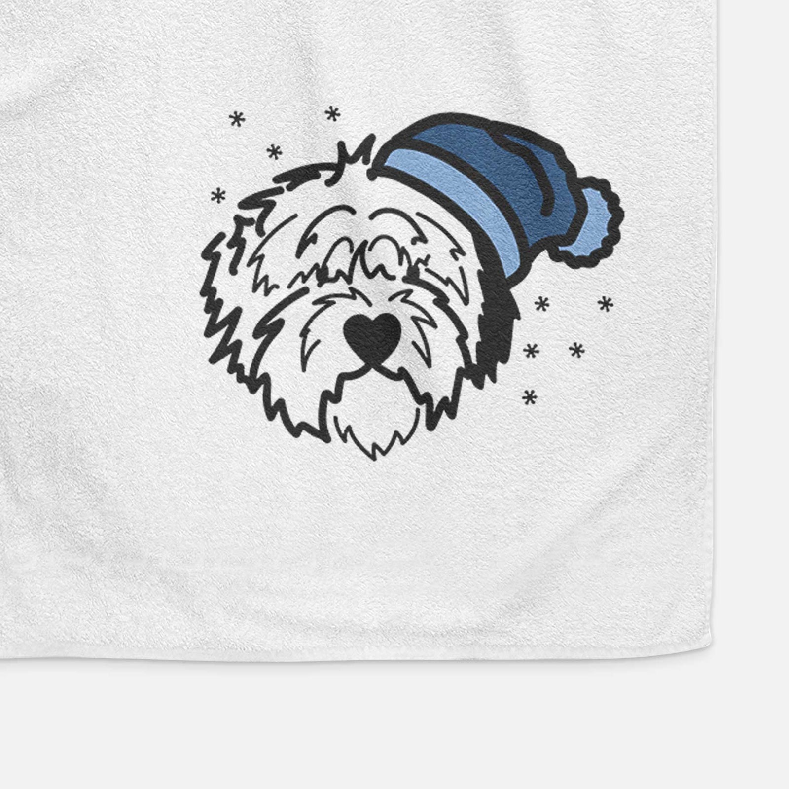 Minimalist line drawing of Penny the Old English Sheepdog wearing a winter beanie on a decorative hand towel