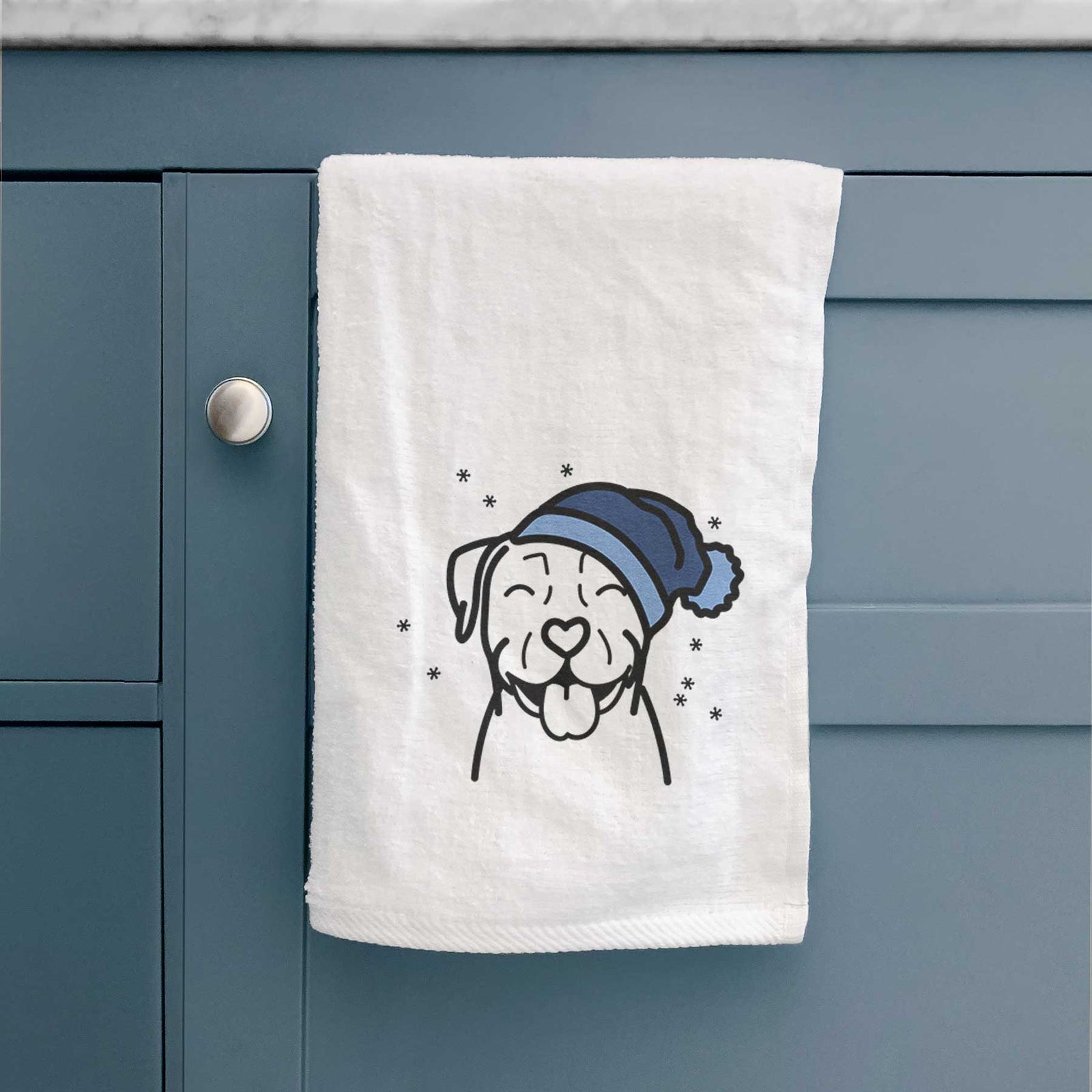 Minimalist line drawing of a Pitbull wearing a winter beanie on a decorative hand towel